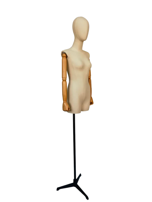 Angled view of a XINTU female torso mannequin, featuring an off-white fabric body, abstract head, articulated beech wood arms, and a black stand.