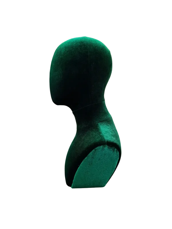 Side profile of a XINTU male abstract mannequin head, upholstered in dark green velvet for accessory display.