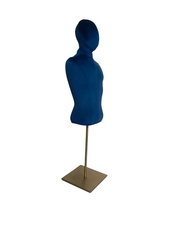 Angled view of a XINTU male bust form, upholstered in navy blue velvet, armless, with a square metal base.