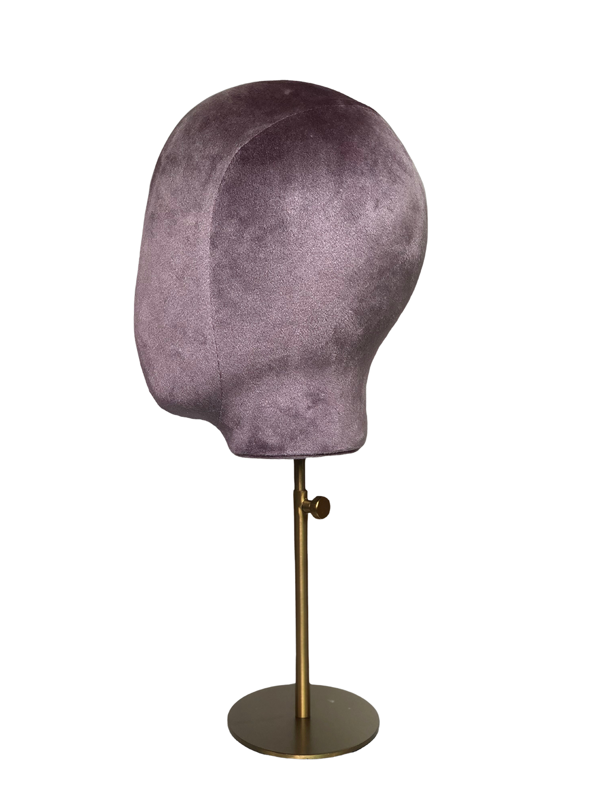 Perfil lateral de una cabeza de maniquí abstracta XINTU, tapizada en terciopelo rosa púrpura, sobre un soporte redondo de metal dorado.