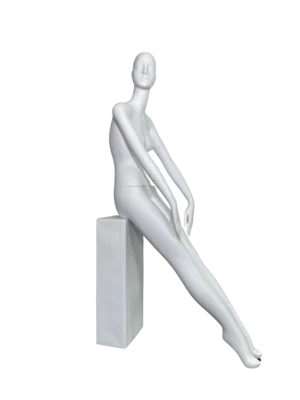 white female retail display mannequin with abstract head seated on block with long legs for boutique fashion window display by XINTU mannequin factory