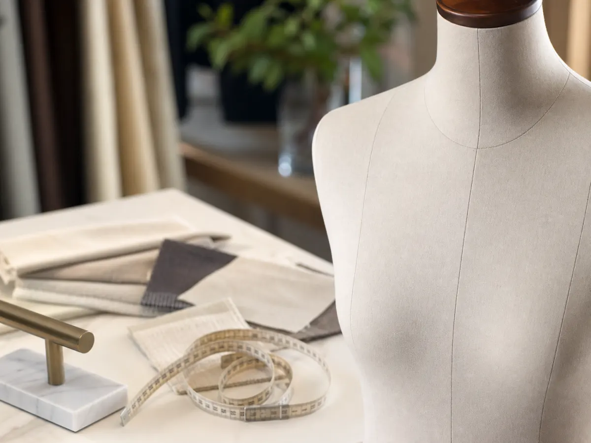 Close-up of fabric covered mannequin measurement review with swatches